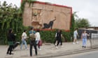 Banksy’s billboard cat removed as meaning of his London animals revealed