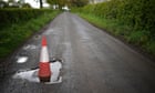 ‘A national disgrace’: cyclists and motorists lament UK’s pothole-ridden roads