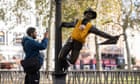 Campaigners tie baby slings to statues in call for better UK paternity leave